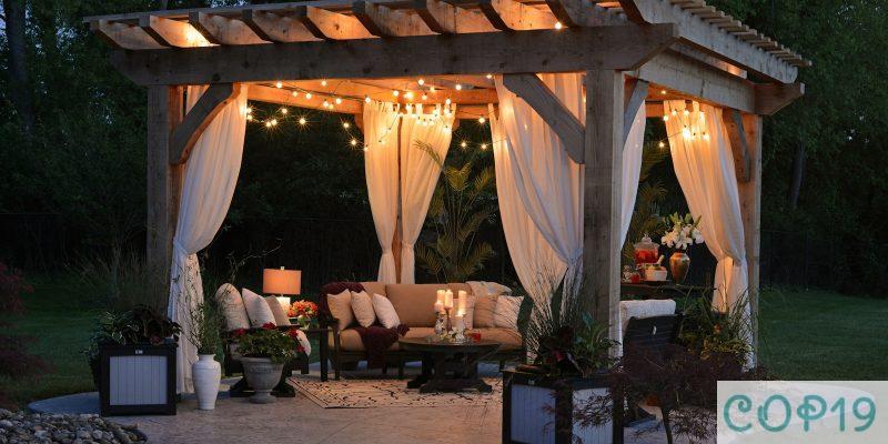 photo of gazebo with curtain and string lights